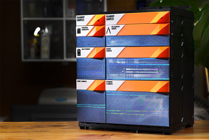 A tabletop build with EdgeLabel faceplates: orange label bands over dark accent panels, each drawer labeled