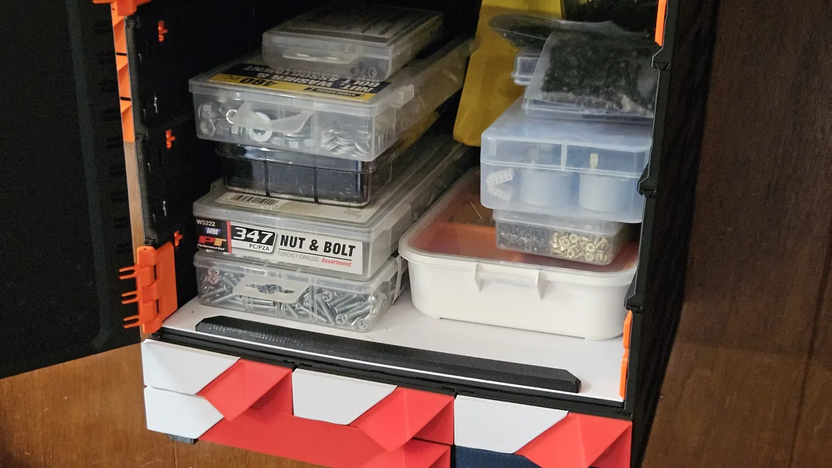 A Shelf Insert fitted in a MODULITH case, holding small parts boxes