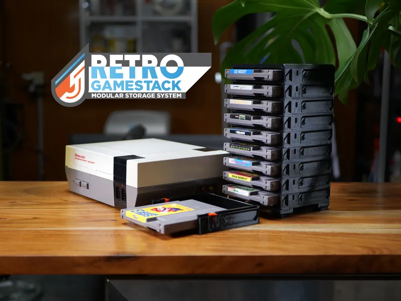RETRO GameStack tower holding NES cartridges beside an NES console, one cartridge tray slid open