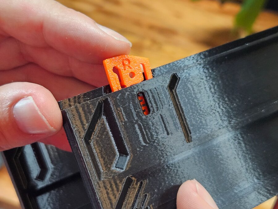 A QuickLock dropping into its slot on the drawer case