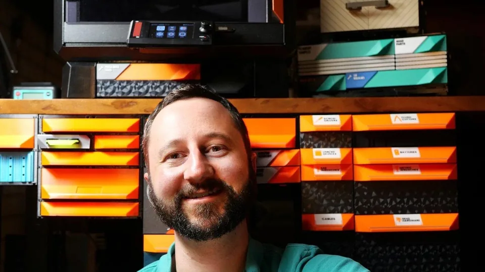 Jerrari in the workshop, in front of a wall of orange MODULITH drawers